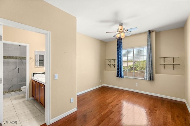 17 Morninglow Pass, Henderson, NV 89052 - empty room with baseboards, ceiling fan, and light wood-style floors