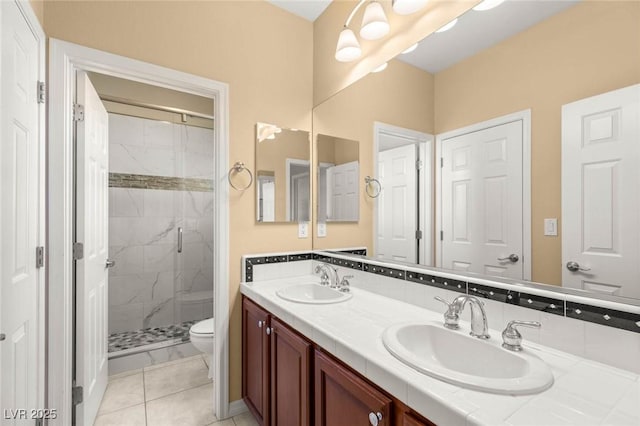 17 Morninglow Pass, Henderson, NV 89052 - full bath featuring toilet, double vanity, a sink, and a shower stall
