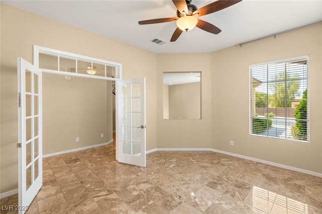17 Morninglow Pass, Henderson, NV 89052 - spare room featuring a ceiling fan, visible vents, french doors, and baseboards