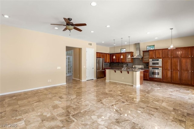 17 Morninglow Pass, Henderson, NV 89052 - kitchen with stainless steel appliances, a kitchen bar, open floor plan, and wall chimney range hood