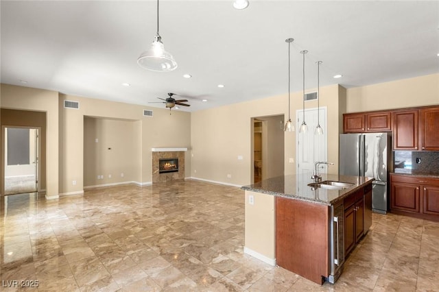 17 Morninglow Pass, Henderson, NV 89052 - kitchen featuring freestanding refrigerator, visible vents, a ceiling fan, and a sink