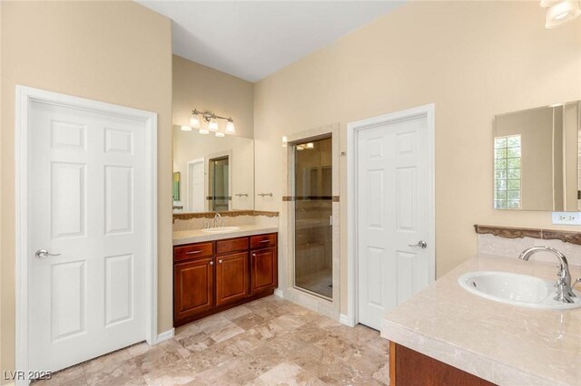 17 Morninglow Pass, Henderson, NV 89052 - full bathroom with two vanities, a shower stall, and a sink