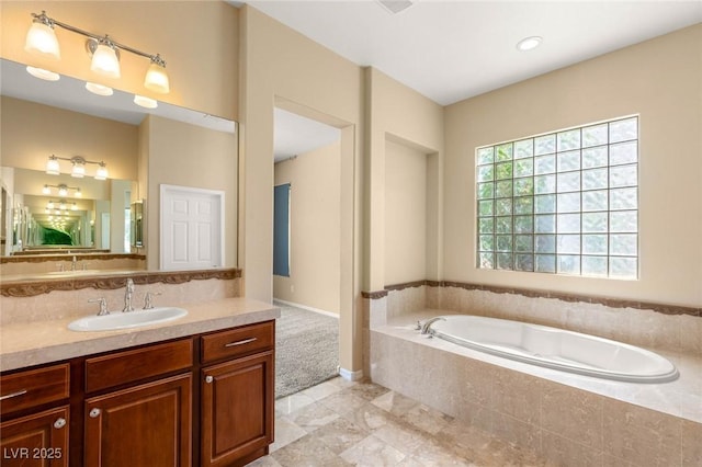 17 Morninglow Pass, Henderson, NV 89052 - full bathroom with baseboards, tasteful backsplash, a garden tub, and vanity