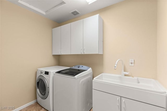 17 Morninglow Pass, Henderson, NV 89052 - washroom with a sink, visible vents, baseboards, washer and clothes dryer, and cabinet space
