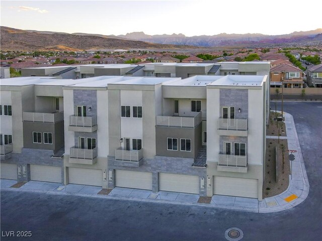 1187 Blossom Point St Unit 36, Las Vegas, NV 89135 - view of property featuring a residential view, a mountain view, and a garage