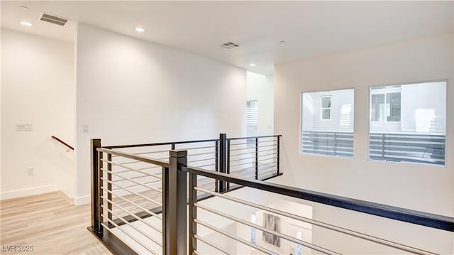 1187 Blossom Point St Unit 36, Las Vegas, NV 89135 - corridor featuring visible vents, an upstairs landing, and light wood finished floors