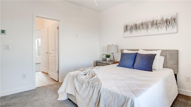 1187 Blossom Point St Unit 36, Las Vegas, NV 89135 - carpeted bedroom featuring baseboards and connected bathroom