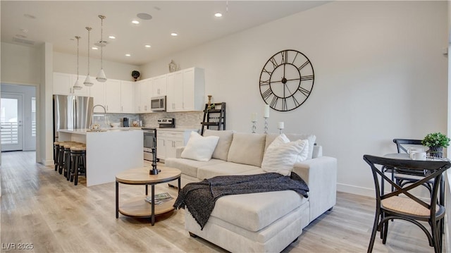 1181 Blossom Point St, Las Vegas, NV 89135 - living area with recessed lighting, light wood-style flooring, and baseboards