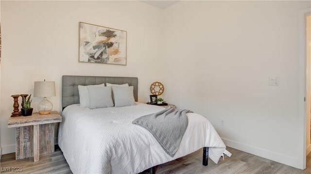 1181 Blossom Point St, Las Vegas, NV 89135 - bedroom with baseboards and wood finished floors