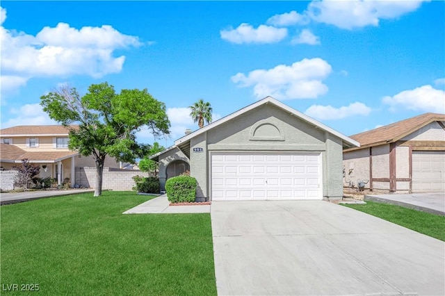 ranch-style home featuring a front lawn, concrete driveway, and an attached garage