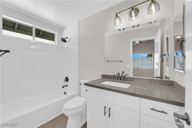 bathroom with toilet, vanity, and shower / bathing tub combination