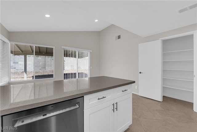 kitchen with dishwasher, a healthy amount of sunlight, lofted ceiling, and visible vents