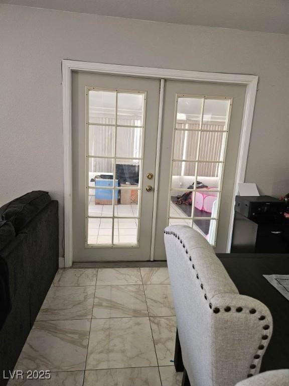 doorway featuring marble finish floor