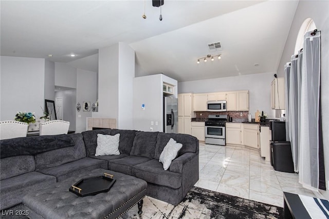 2631 Bed Knoll Ct, North Las Vegas, NV 89031 - living area with light marble finish floors and high vaulted ceiling