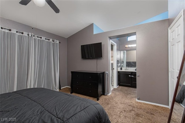 2631 Bed Knoll Ct, North Las Vegas, NV 89031 - bedroom featuring vaulted ceiling, light carpet, ceiling fan, and ensuite bath