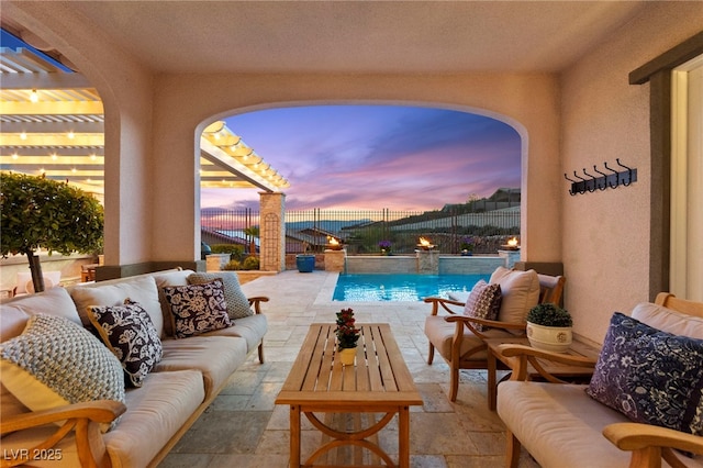 pool at dusk featuring outdoor lounge area, a pergola, a fenced backyard, a fenced in pool, and a patio area