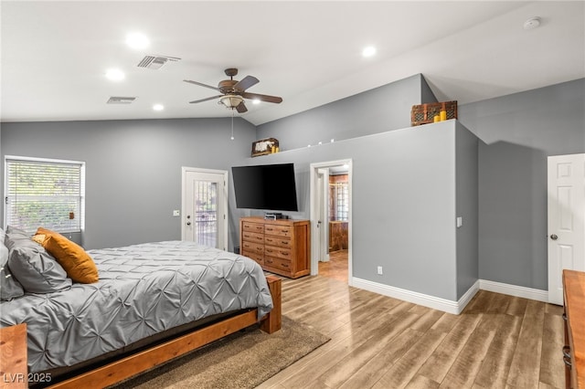 bedroom with visible vents, access to exterior, light wood-type flooring, and lofted ceiling
