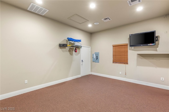 interior space with visible vents, recessed lighting, and electric panel
