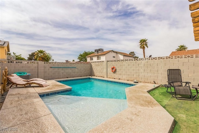 view of swimming pool featuring a patio, a fenced in pool, and a fenced backyard