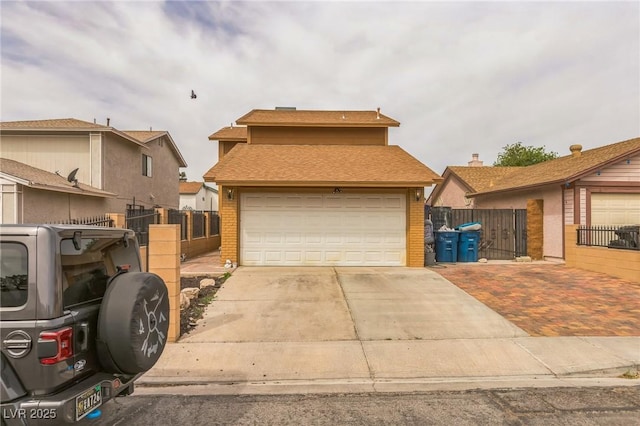 traditional-style house featuring brick siding, fence, and driveway