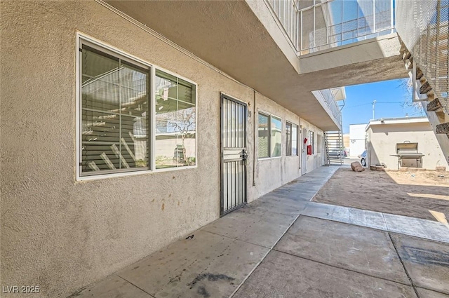 view of home's exterior featuring stucco siding and a patio