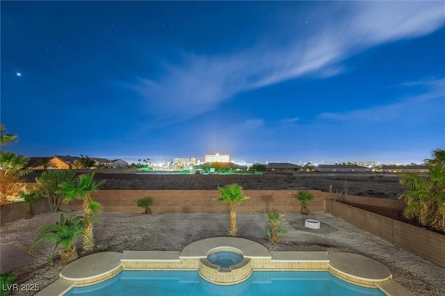 view of pool with an in ground hot tub, a fenced in pool, and a fenced backyard