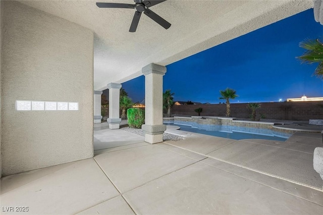 view of swimming pool with a fenced in pool, a fenced backyard, ceiling fan, and a patio area