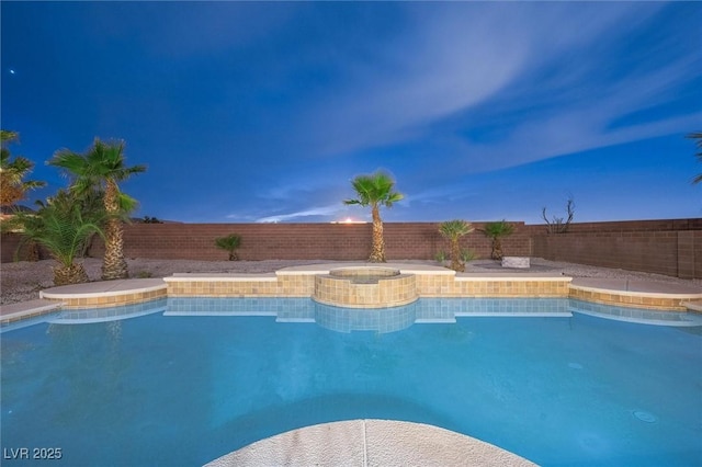 view of swimming pool with a fenced in pool, a fenced backyard, and an in ground hot tub