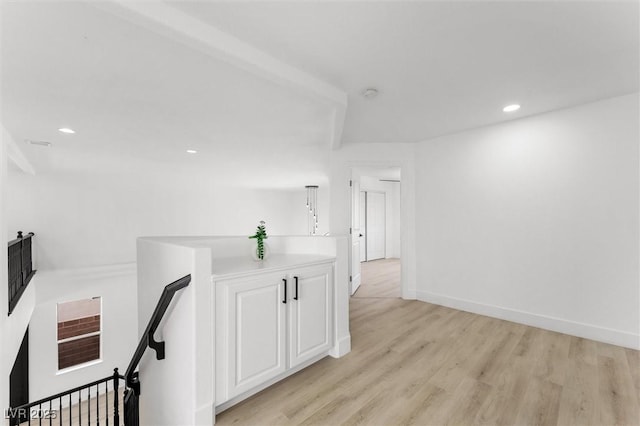 unfurnished room featuring recessed lighting, light wood-style flooring, and baseboards