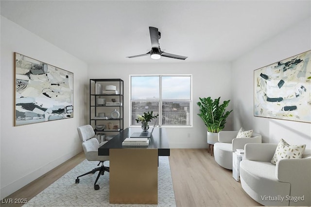 office featuring baseboards, ceiling fan, and wood finished floors