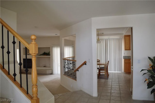 hallway featuring light tile patterned floors
