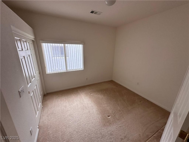 unfurnished bedroom with carpet and baseboards