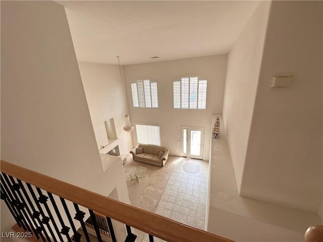 stairway with a towering ceiling