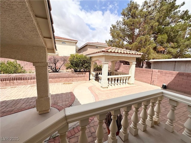 view of patio featuring a fenced backyard and a gazebo