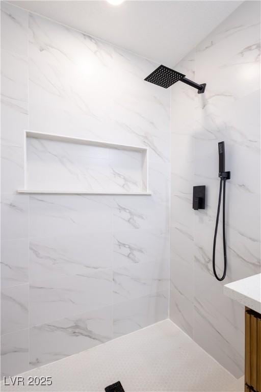 full bathroom featuring a marble finish shower