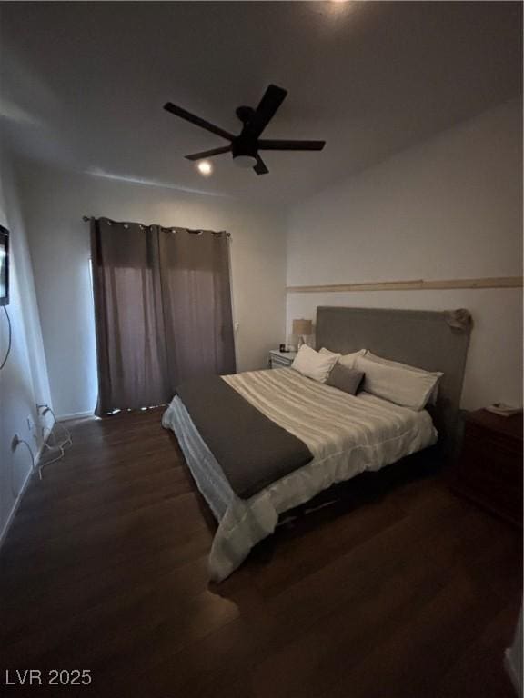 bedroom featuring wood finished floors and a ceiling fan
