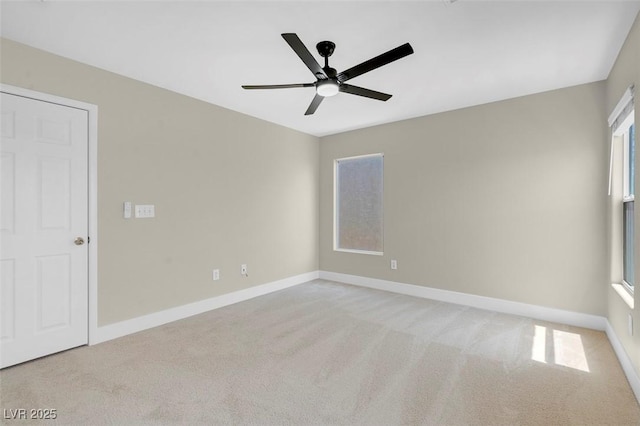 unfurnished room featuring baseboards, ceiling fan, and carpet flooring