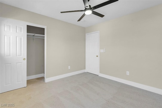 unfurnished bedroom with baseboards, a ceiling fan, carpet floors, and a closet