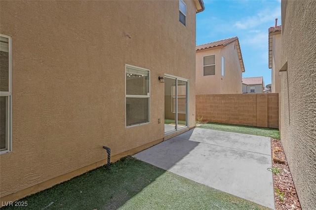 view of patio / terrace featuring fence