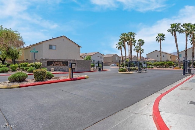 view of road with curbs, sidewalks, and a residential view