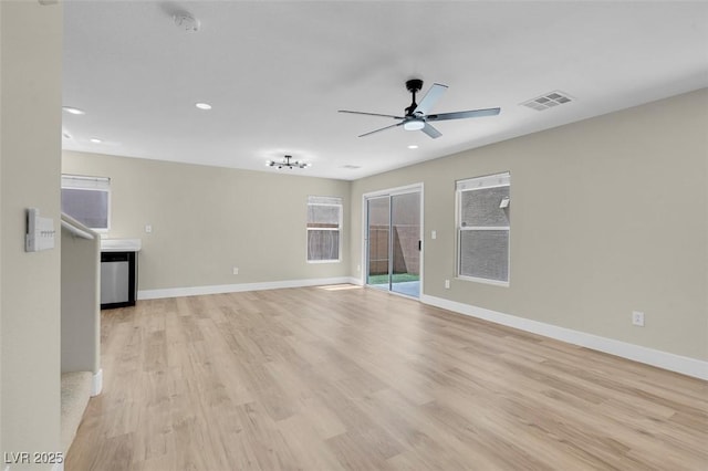 unfurnished living room with light wood-style flooring, visible vents, baseboards, recessed lighting, and a ceiling fan