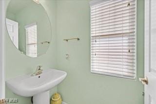 bathroom with a sink and plenty of natural light