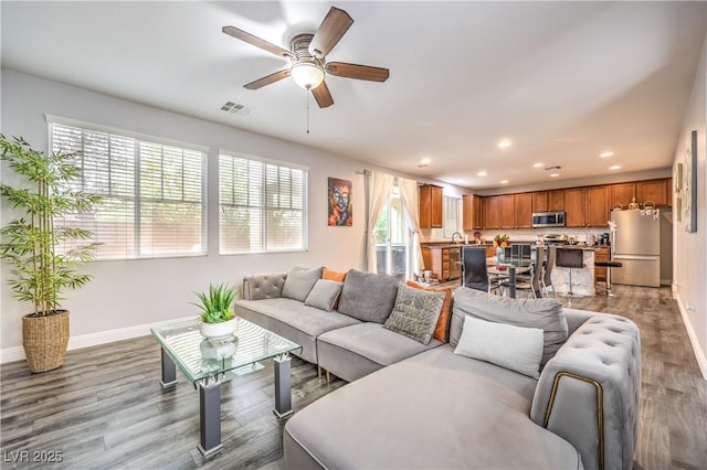 6554 Macdoogle St, Las Vegas, NV 89166 - living area featuring baseboards, recessed lighting, wood finished floors, and a ceiling fan