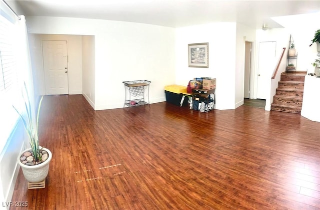 6429 Rosemount Ave, Las Vegas, NV 89156 - living room featuring stairs, wood finished floors, and baseboards