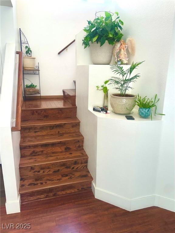 6429 Rosemount Ave, Las Vegas, NV 89156 - staircase with wood finished floors and baseboards