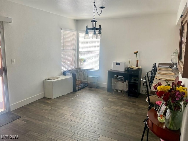 6429 Rosemount Ave, Las Vegas, NV 89156 - dining area featuring wood finished floors, a chandelier, and baseboards