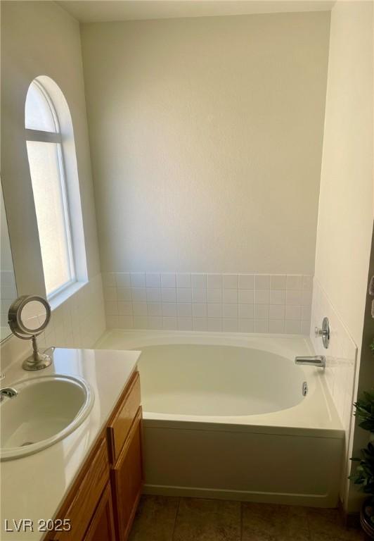 6429 Rosemount Ave, Las Vegas, NV 89156 - full bath with vanity, a garden tub, and tile patterned floors