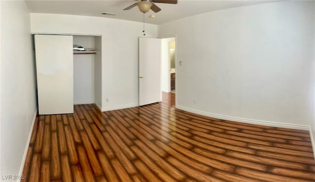 6429 Rosemount Ave, Las Vegas, NV 89156 - unfurnished bedroom featuring wood finished floors, baseboards, a closet, and a ceiling fan