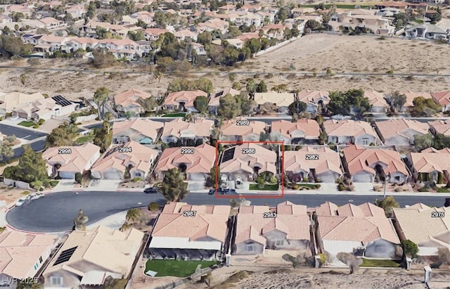 birds eye view of property with a residential view