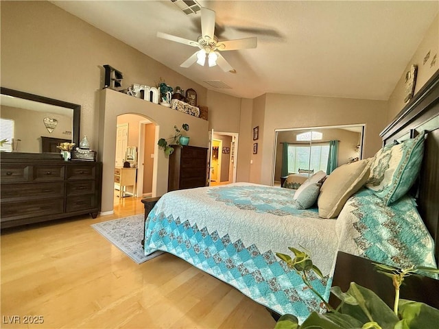 2986 Matese Dr, Henderson, NV 89052 - bedroom featuring visible vents, lofted ceiling, light wood-style floors, ceiling fan, and arched walkways